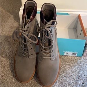 Barefoot woman’s boots